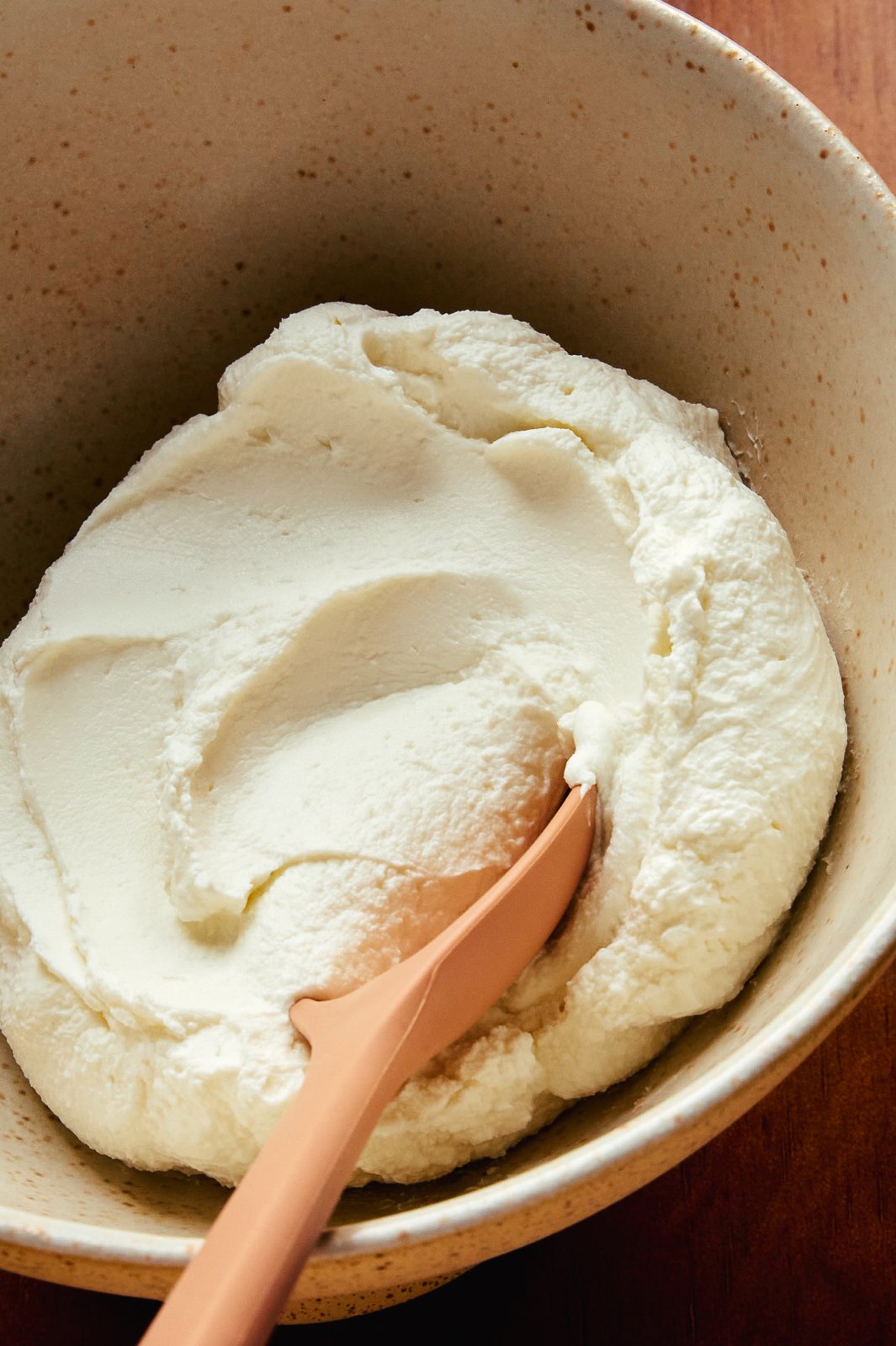 Labneh with a spoon in a clean bowl